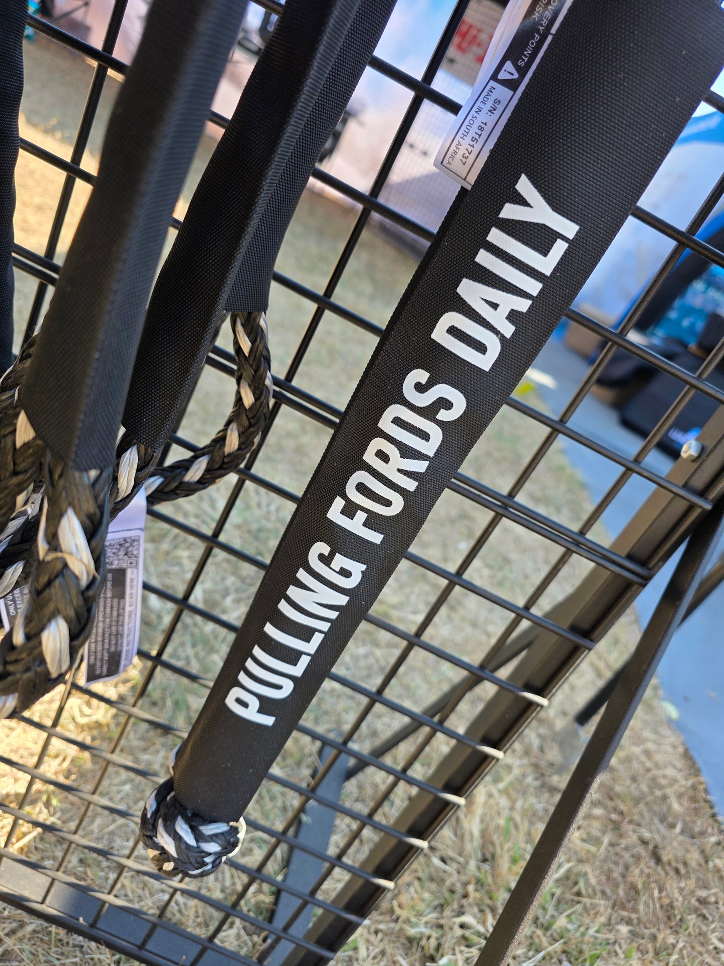 Black soft shackle strap with printed “PULLING FORDS DAILY” and braided end loop