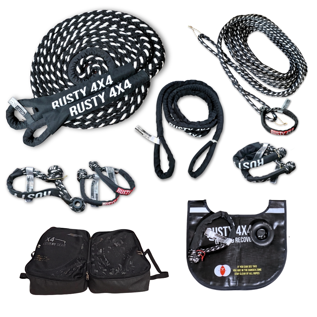 All in one complete offroad recovery kit packed apart showing all the various products, kinetic rope, soft shackles, winch extension, bridle, winch damper, snatch block synthetic winch ring and canvas bag.