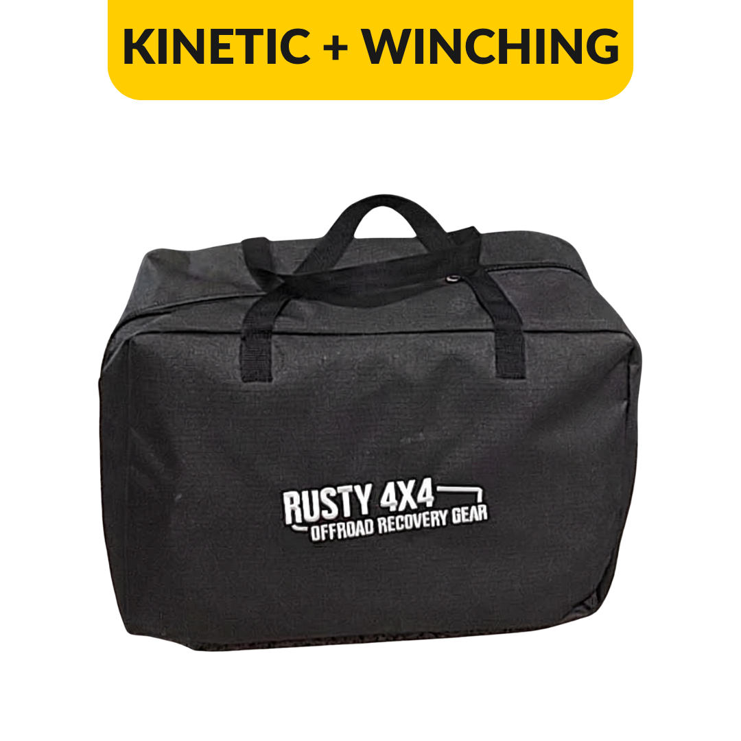 A black fabric recovery gear bag with white 'RUSTY 4X4 OFFROAD RECOVERY GEAR' text on the front, shown on a white background with a yellow banner at the top reading 'KINETIC + WINCHING'.