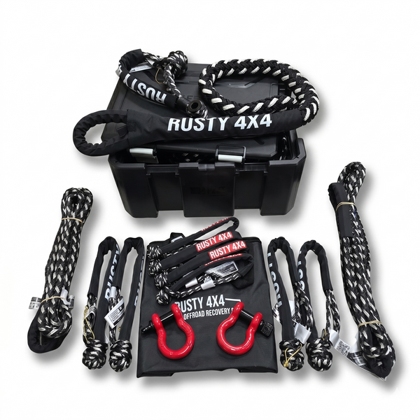 Rusty 4x4 off-road recovery equipment set with black toolbox, ropes, and hooks on a white background.
