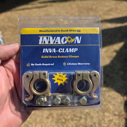 Brass quick-connect battery terminal plugs in blister pack with two clamps and hardware