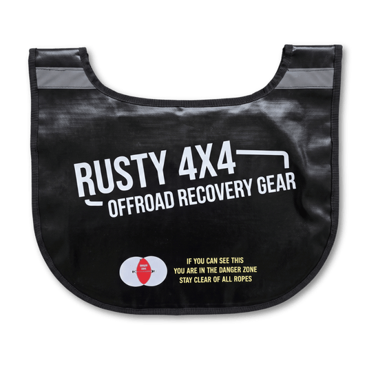 Black winch recovery dampener blanket with curved bib shape and warning label
